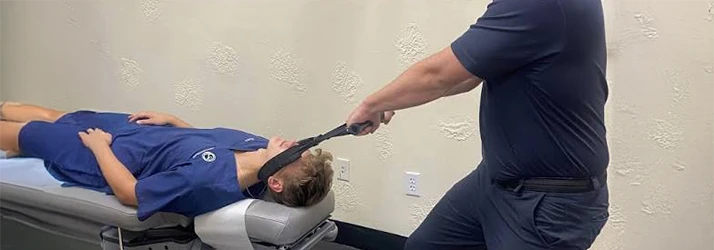 Chiropractic Cumming GA Patient Receiving Y-Strap Adjustment